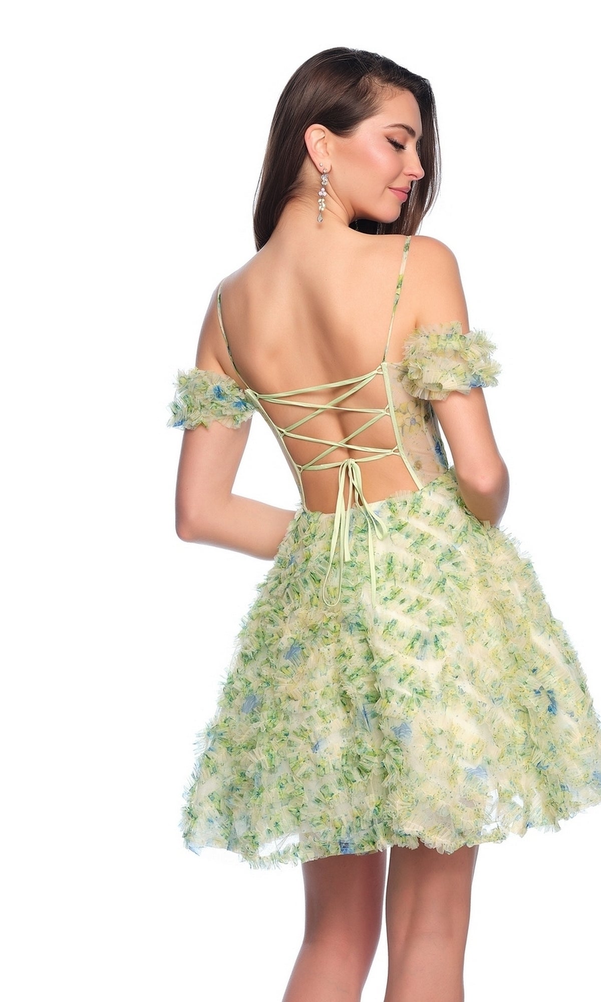 Model showcasing the Dave and Johnny Short Green Print Hoco Dress 11767 with a lace-up corset bodice, textured floral patterns, off-shoulder and open-back design, facing away and glancing over her shoulder.